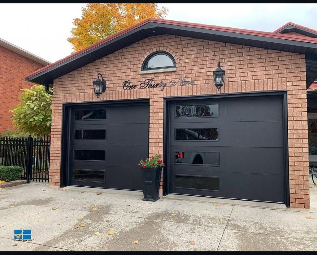 Black flush-panel garage door installed by Pro Entry