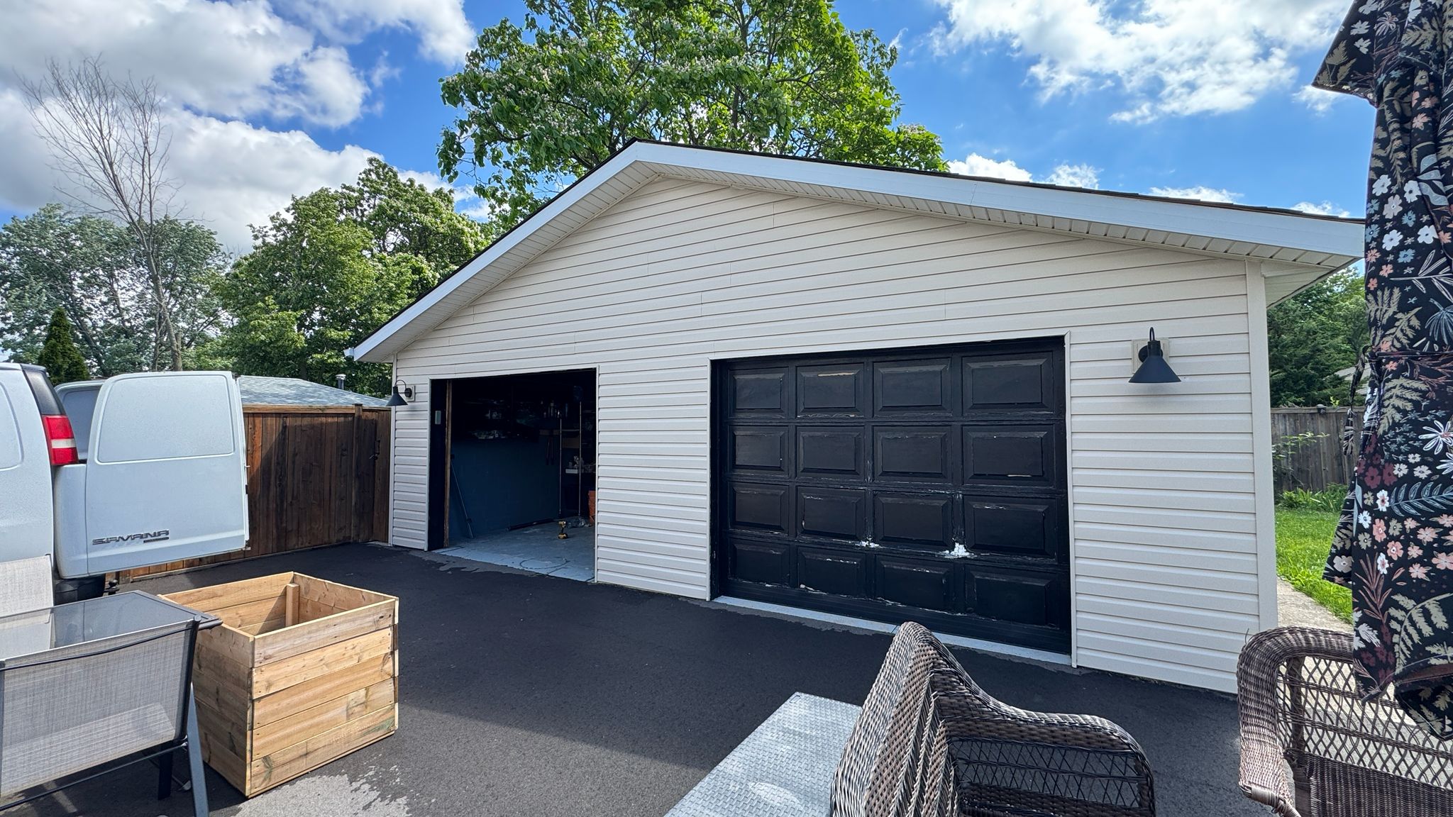 Before: aging black garage door prior to replacement