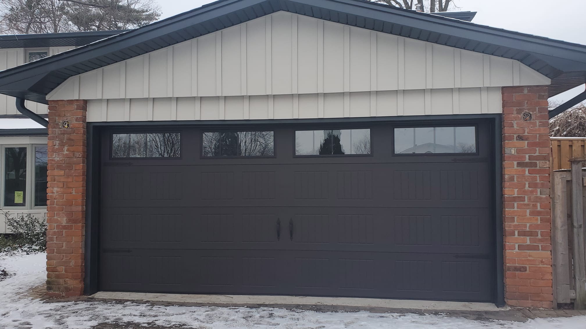 traditional garage door with top windows - Pro Entry Services