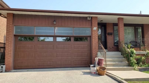 Brown double-car garage door installation for a house in Lakeshore Mississauga by Pro Entry