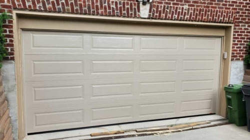 Double-Car garage door without windows installed in Toronto by Pro Entry