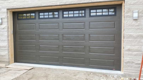 Grey double-car garage door installed in Oakville by Pro Entry