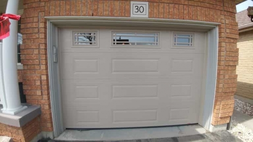 Light Brown single-car garage door installed by Pro Entry in Ontario