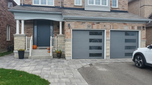 modern garage door with side windows - Pro Entry Services